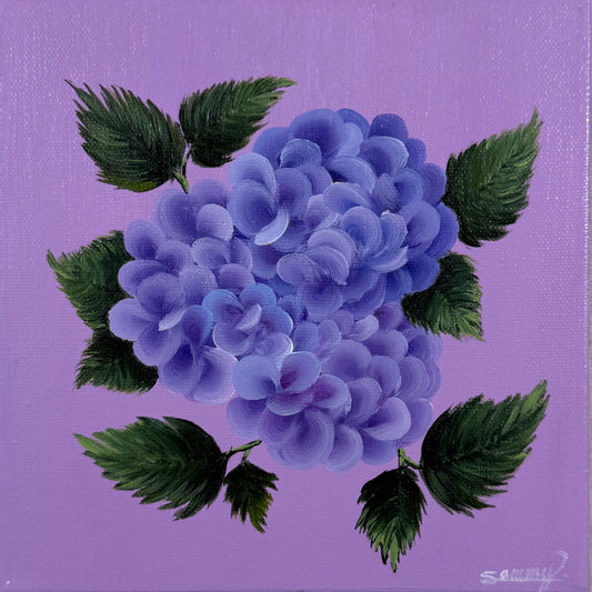 A square canvas painting featuring a purple and blue hydrangea with green leaves on a lavender background, displayed against a textured off-white wall.