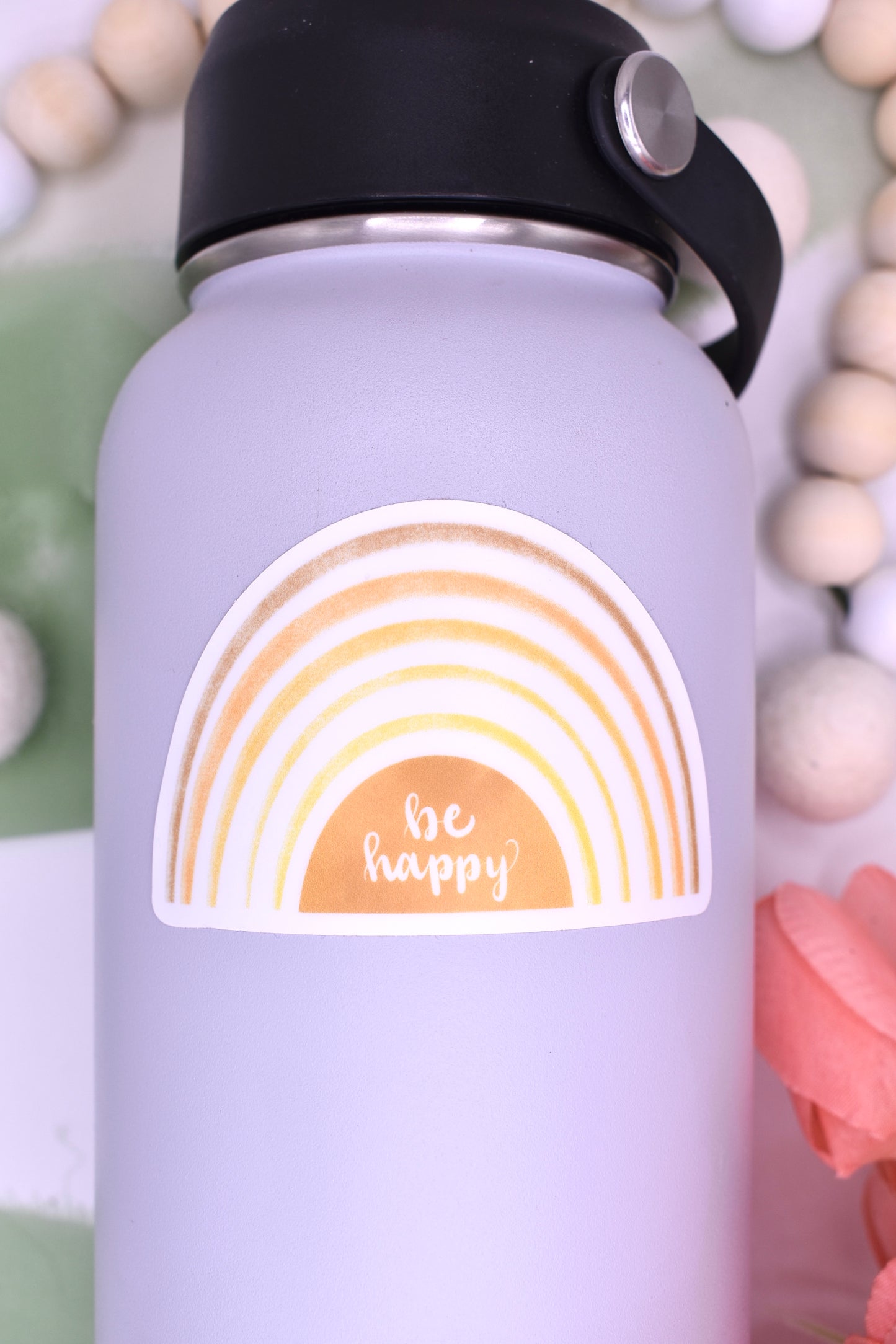 Yellow gradient rainbow sticker with white background and the words "be happy"