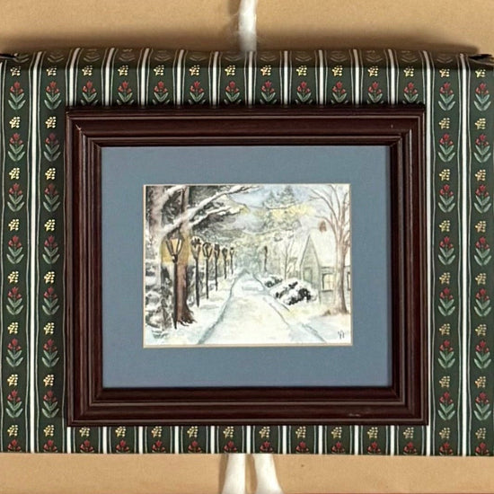 Collection of wrapped Christmas presents with ribbons and decorative boxes.