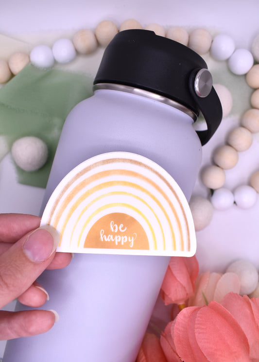 Yellow gradient rainbow sticker with white background and the words "be happy" 